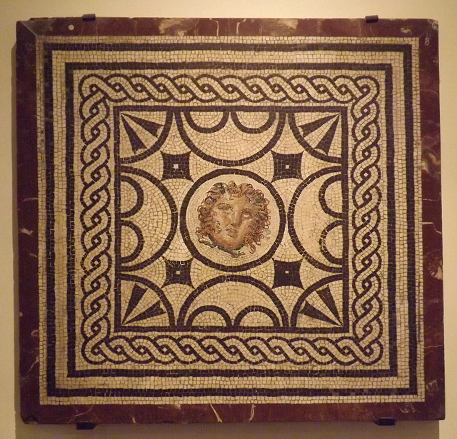 Mosaic Emblema with a Medusa Head from the House of the Vestals in Pompeii in the Naples Archaeological Museum, July 2012