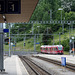 RhB-Zugkomposition verlässt den Bahnhof Filisur in Richtung Davos - 2015-06-12--D4 DSC2632