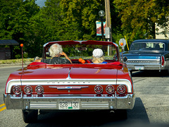 Red Chevy Impala and a Pontiac Parisienne