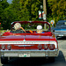 Red Chevy Impala and a Pontiac Parisienne