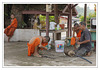 Monks build a plug on a submersible pump in Ban Xang Hai
