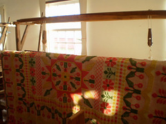 Loom and 120 years old quilt.