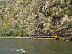 Train along and upstream Douro River.