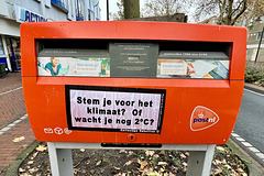 Climate-protest sticker on a postbox