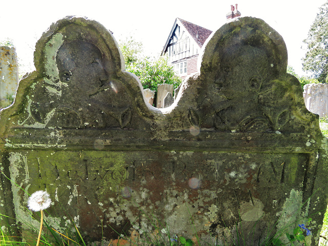speldhurst church, kent.unusual busts with trumpets on lugs of early c18 gravestone c.1740
