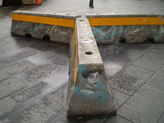 Street art on concrete barrier.