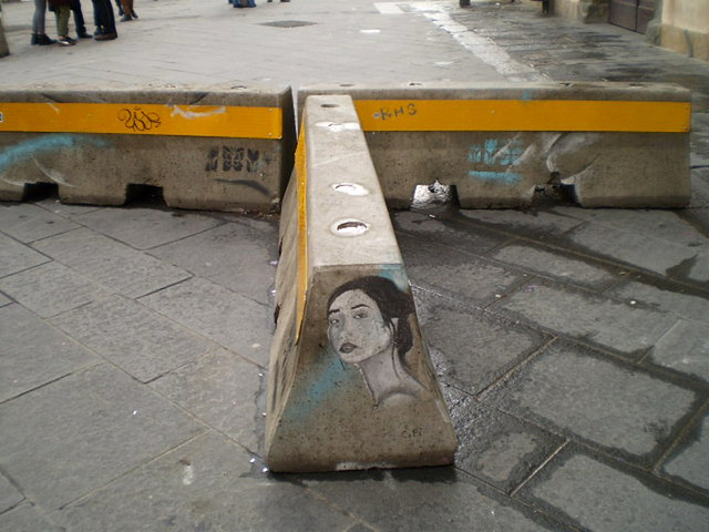 Street art on concrete barrier.