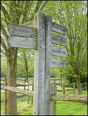 wooden path signpost