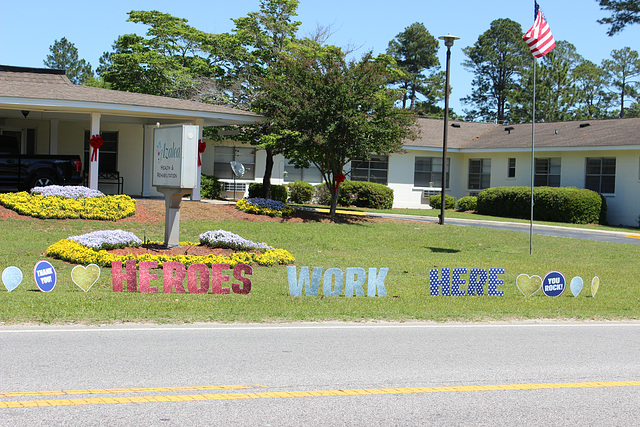 HEROES WORK HERE!!  (out front of a local Health and Rehabilitation Center ) ..
