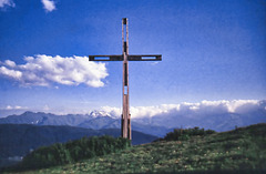 A Cross facing the majestic Caucasus