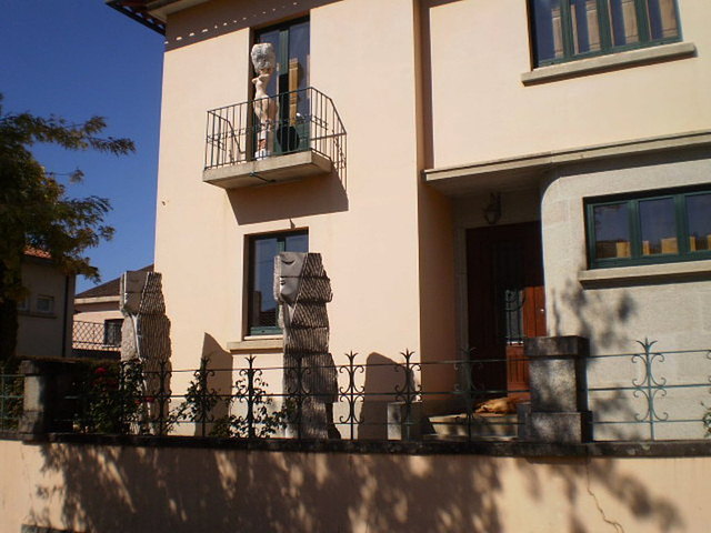 House with sculptures.
