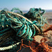 Turquoise and orange ropes on the beach