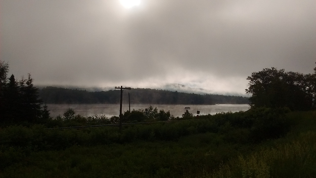 Railroad by the lake fog