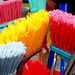 ". . .sweeps with many colored brooms, and leaves the shreds behind. . ."