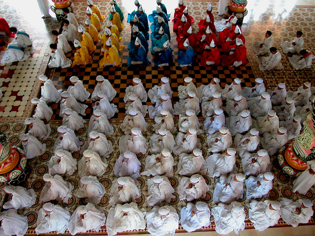 Praying in the Cao Đài Holy See (church) in Tây Ninh