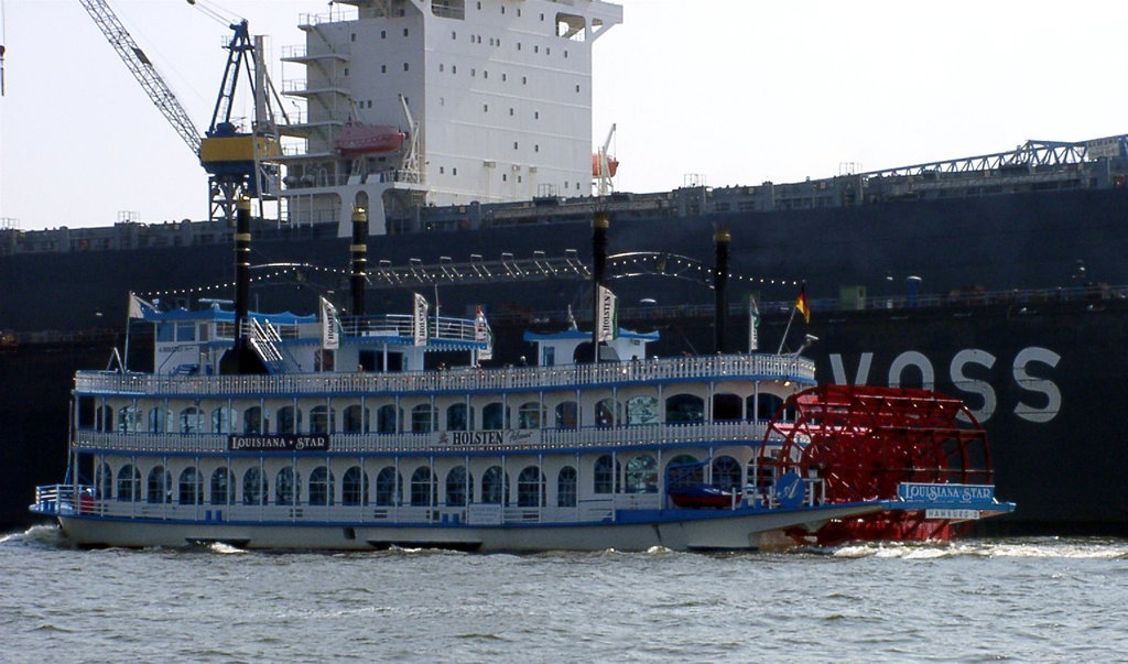 Paddle wheel steamer "Louisana Star" in front of docked "Yokohama Senator"