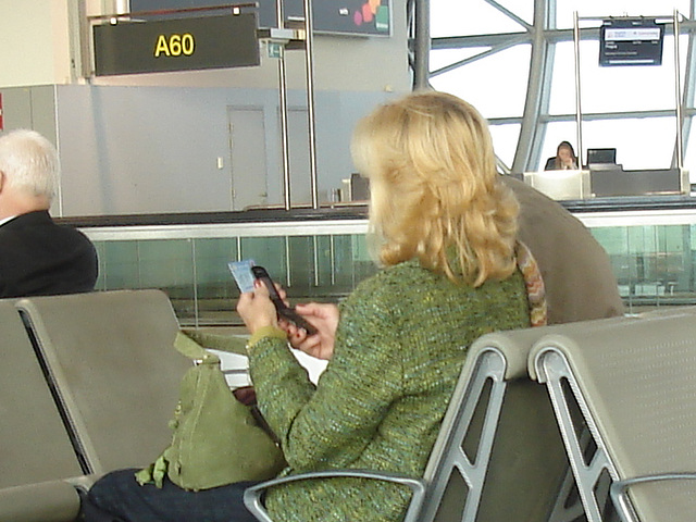 Mature blonde in high heeled Cowgirl boots -  Brussels airport - October 19th 2008