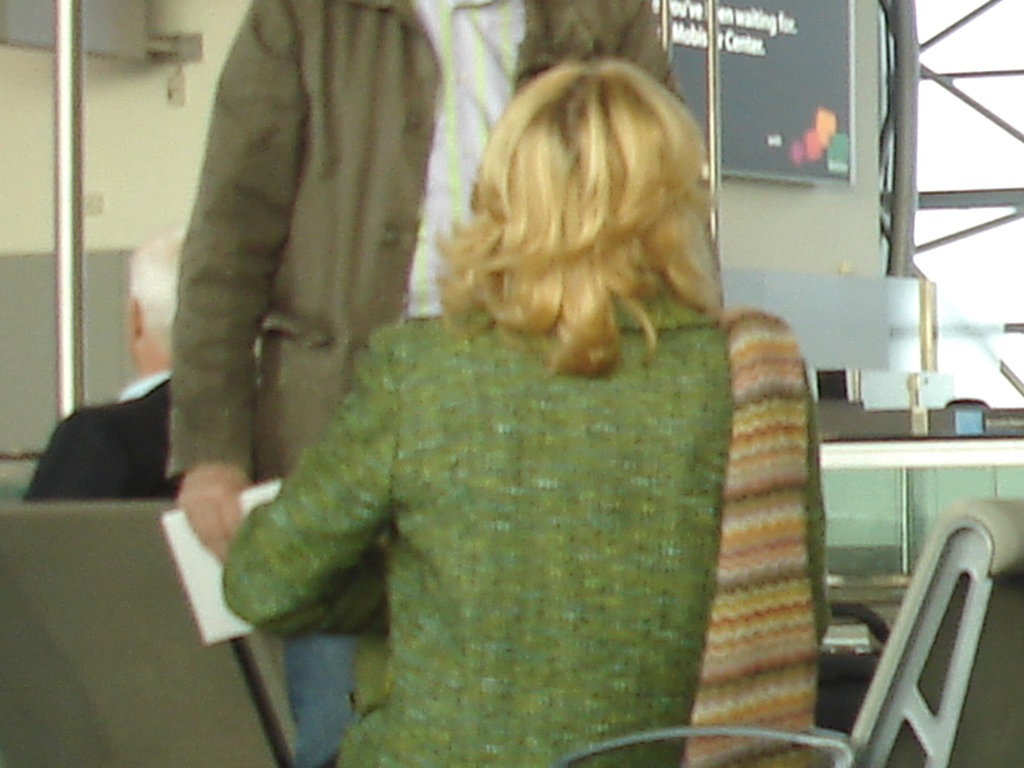 Mature blonde in high heeled Cowgirl boots -  Brussels airport - October 19th 2008