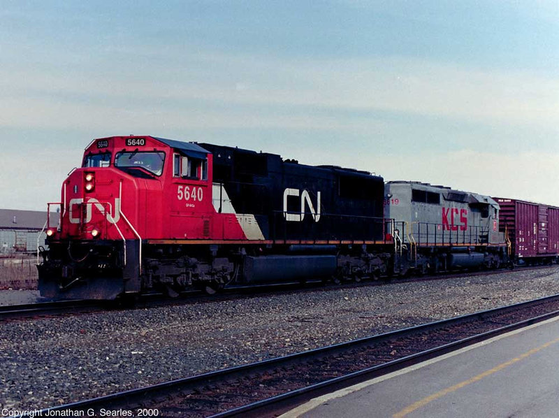 CN #5640 and KCS #6619 With A Mixed Freight At Utica, NY, USA, 2000