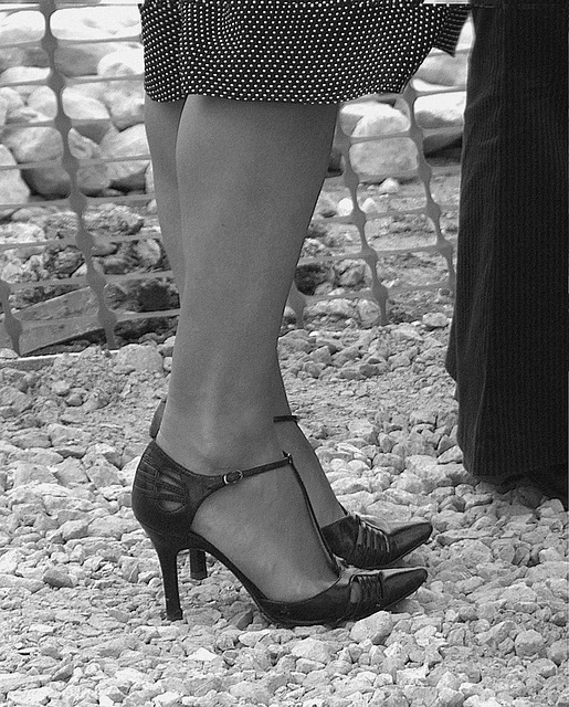 My friend Rachel with permission  /  Mon ami Rachel en talons hauts avec sa permission - My shoes - building site. by Mandy - B & W.