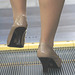 heels on escalator