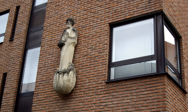 Sandsteinfigur an einem Gebäude in Coesfeld