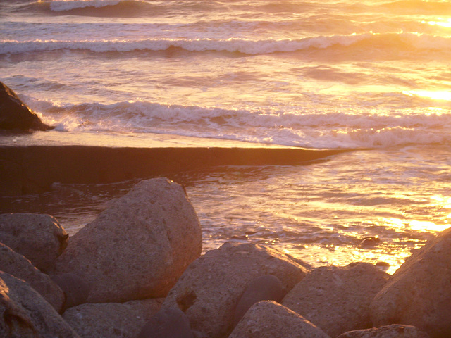 The brilliance of the setting sun on the waves