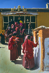 Pilgrims step in the Toling Monastery