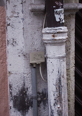 telephone line meets rain pipe