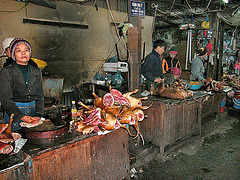 Dog meat butcher at a market in Hanoi