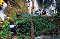 Group photo in front of the Kuang Si Falls