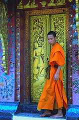 Monk exits Wat Xieng Thong main temple