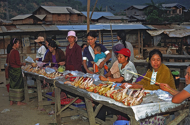 Laos women selling fresh chicken