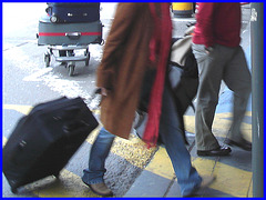 Blond mature in jeans and flat boots  /  Dame mature en  blue-jeans et bottes à talons plats  -  Brussels airport.