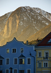 Golden light behind shady houses