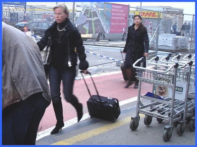 Front park Blonde mature with glasses and low-heeled Boots -  Brussels airport - 19-10-2008