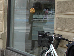 Arkitekter readhead Lady in sexy boots -  Copenhagen  /  Window store reflection.