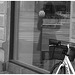Arkitekter readhead Lady in sexy boots -  Copenhagen  /   October 20th 2008. - Window store reflection. B & W.