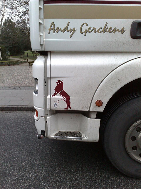 Flower delivery truck with interesting sign