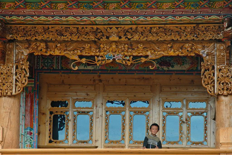 A boy look down the balcony