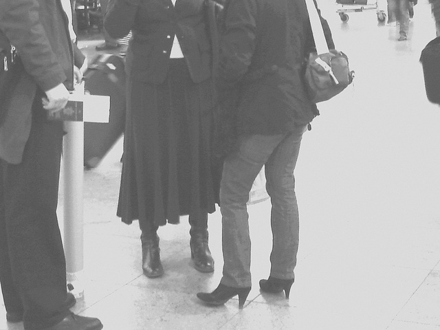 Ultra blond mature and high heeled booted  readhead Lady-   Brussels airport /  19-10-2008 - B & W.