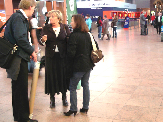 Ultra blonde mature and high heeled booted  readhead Lady-   Brussels airport /  19-10-2008