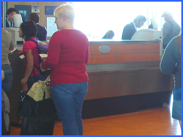Chubby blonde in red and jeans on flats - Blonde mature en souliers plats - PET Montreal airport.