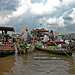 Scene at the floating market Cái Răng on the Hậu Giang river