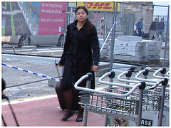 DHL Asian Lady on flats - Brussels airport.