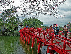 Crossing the Huc Bridge over the Hoàn Kiếm Lake