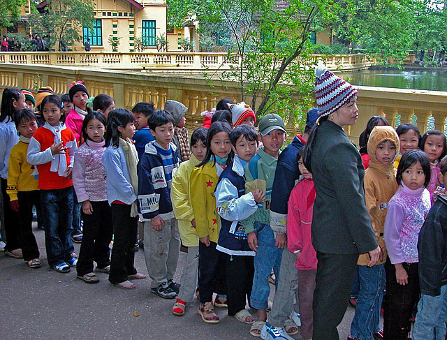 Vietnamese kids waiting to visit Uncle Stilt Ho's house