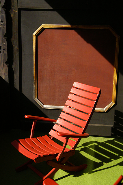 red chair on green soil