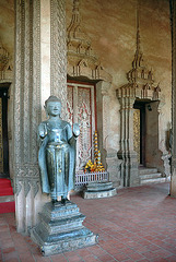 Standing Buddha at the temple entrance