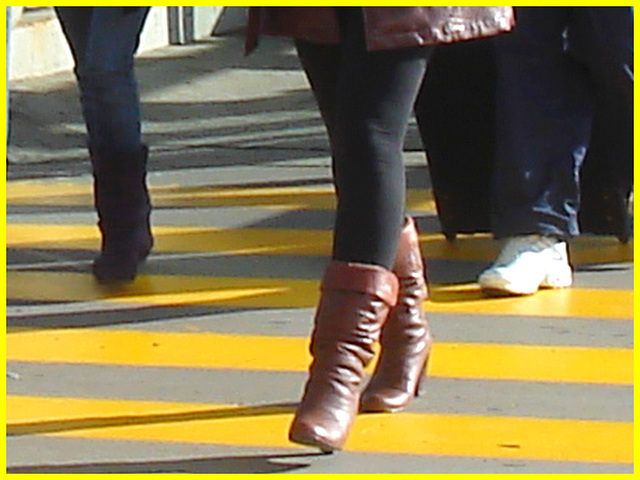 High heeled Boots and tights on yellow lines -  Bottes à talons hauts et collants sur lignes jaunes- Aéroport de Montréal.